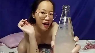 Cute girl drinking water at home